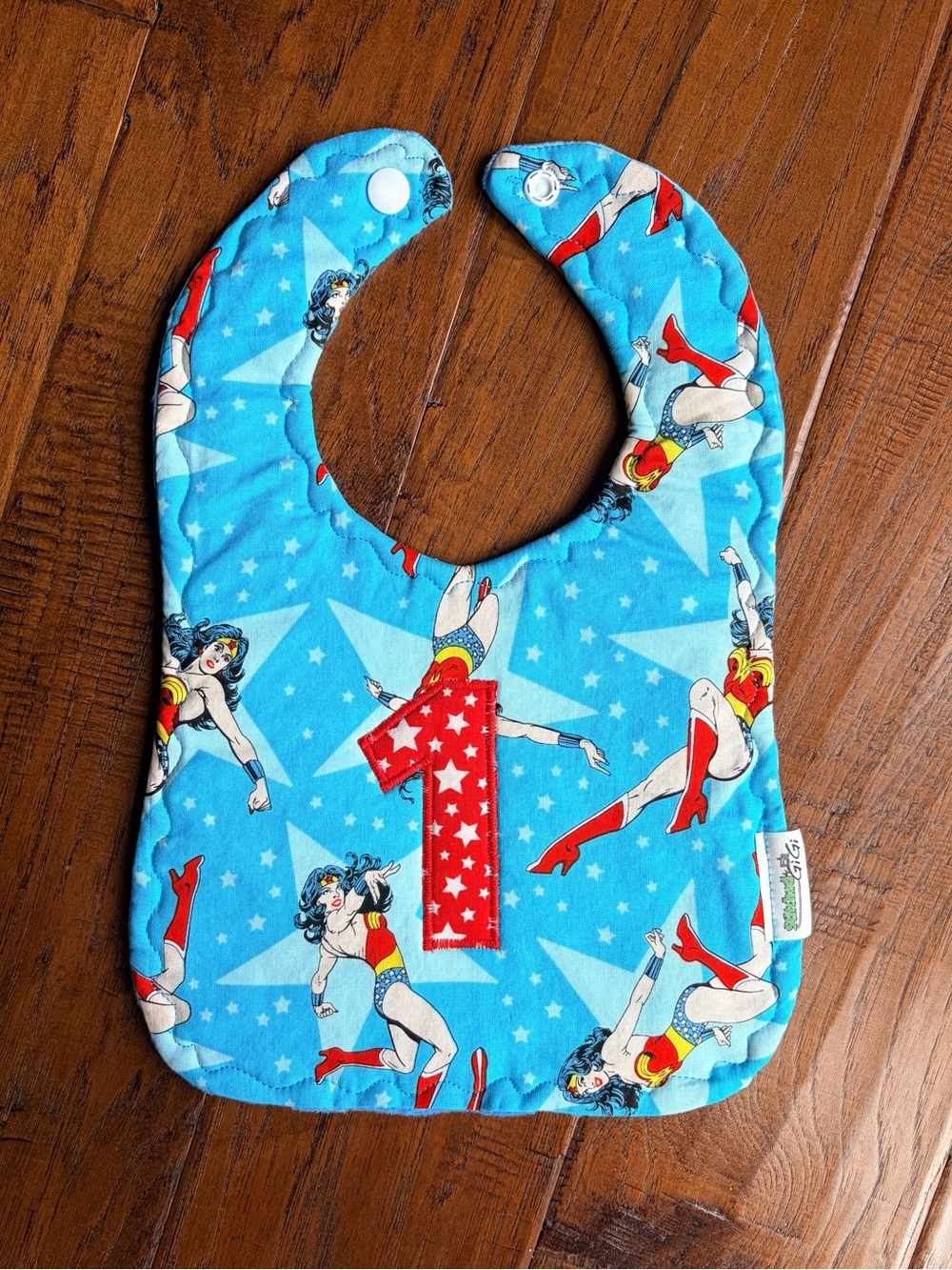 Blue Superhero Wonder Woman Birthday Bib with Big # 1
